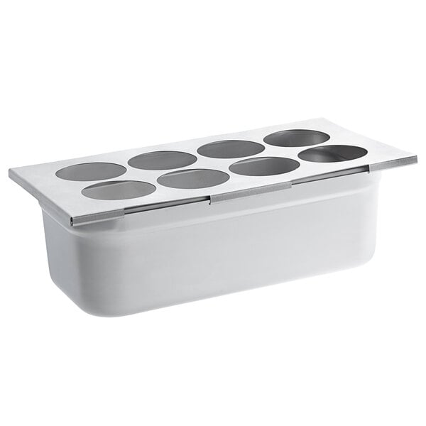 A silver stainless steel container with holes in it.