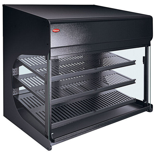 A black rectangular Hatco countertop food warmer with glass doors and shelves.