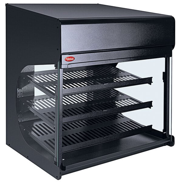 A black Hatco countertop food warmer with shelves and a glass door.