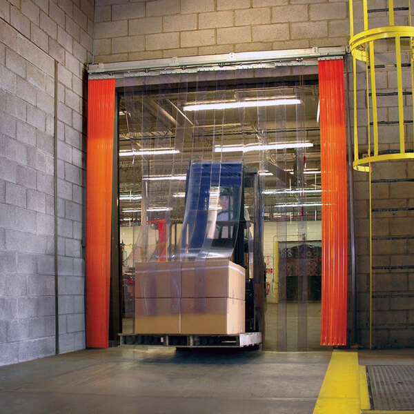 A forklift in a warehouse with a Curtron transparent clear PVC strip door.