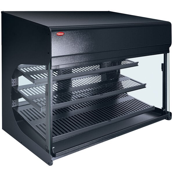 A black rectangular Hatco countertop food warmer with glass shelves.