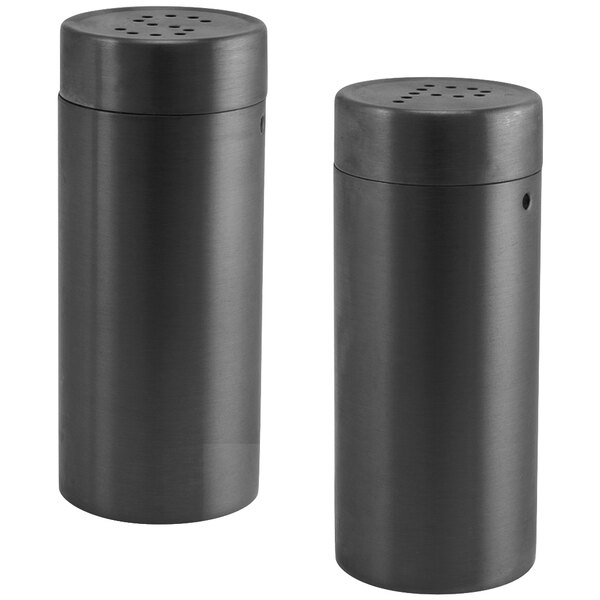 A pair of black cylinder salt and pepper shakers with lids.