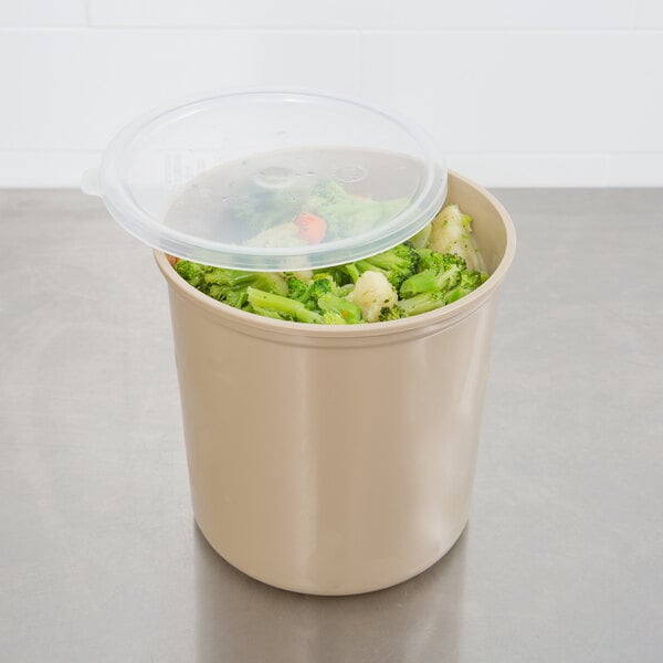 A beige Cambro round polypropylene crock with a lid containing food.