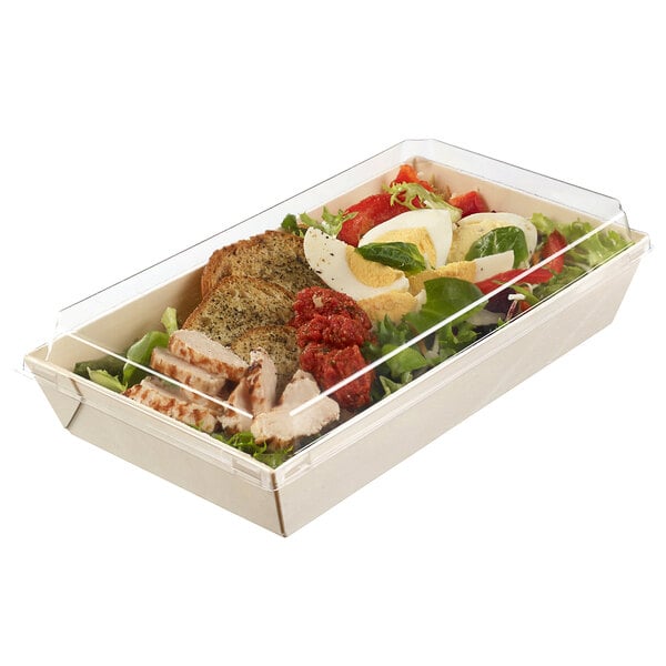 A Solia laminated wooden punnet with a clear plastic lid holding a salad and meat.