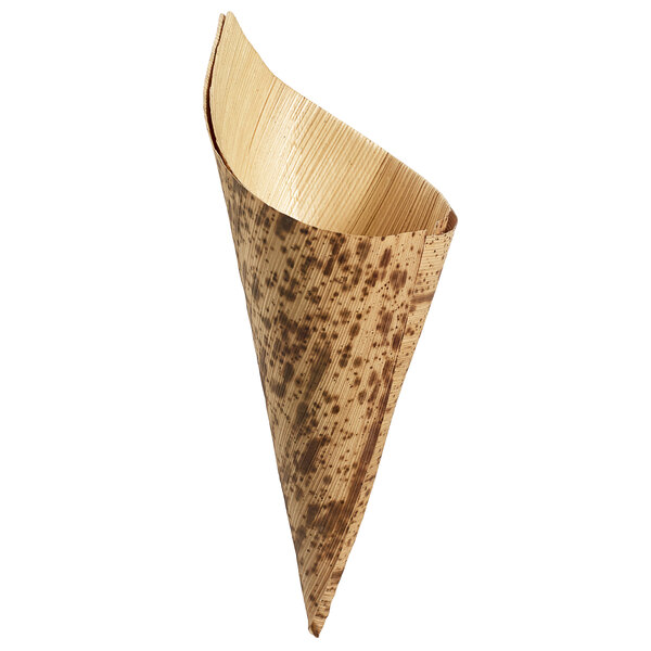 A close-up of a brown bamboo leaf cone with a speckled pattern.