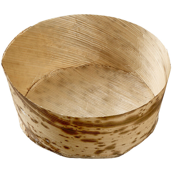 A round wooden Solia bamboo leaf mini dish with a textured circular surface.