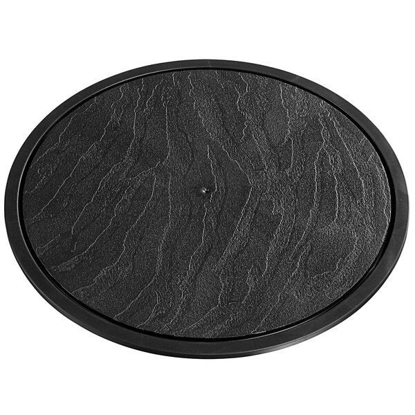 A black circular slate display with a black rim.