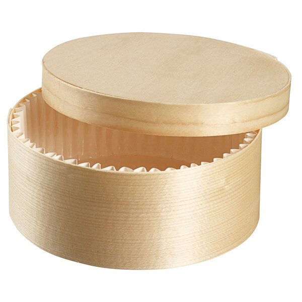 A Solia round wooden baking box with a lid.