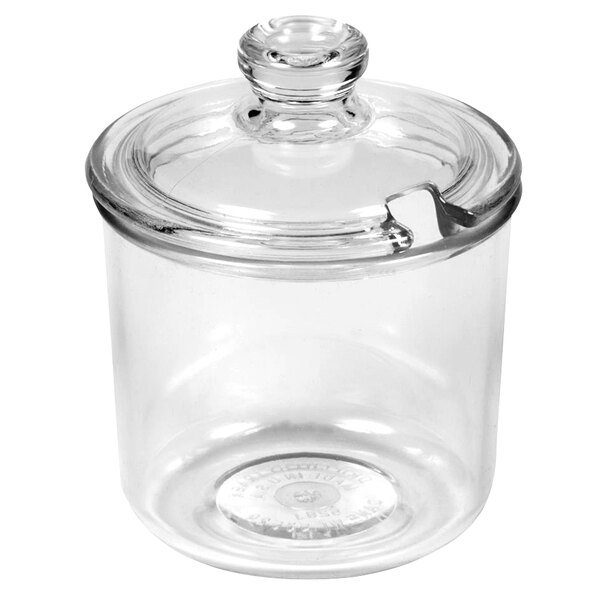 A clear polycarbonate condiment jar with a lid.