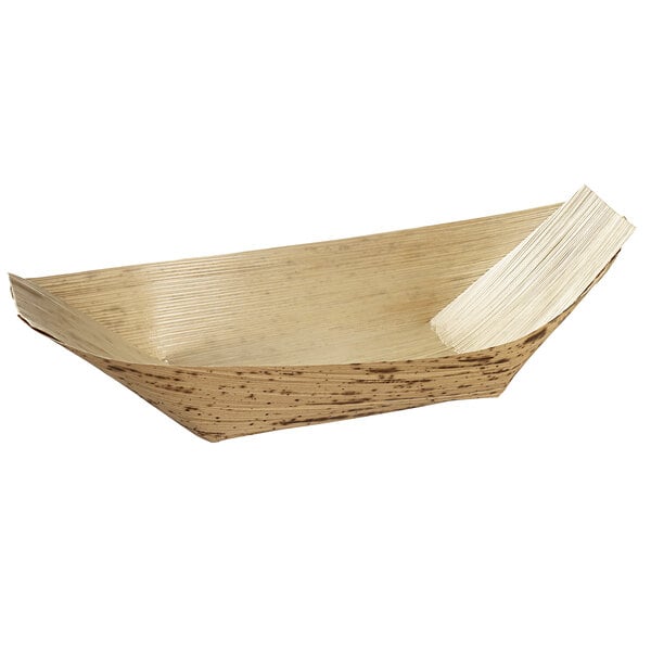 A Solia bamboo leaf boat dish with a white object in it.
