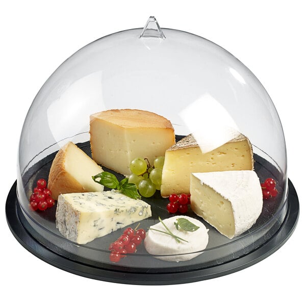 A Solia transparent dome covering a tray of cheese and grapes.
