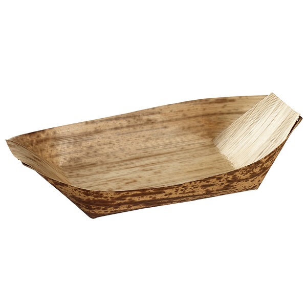 A Solia bamboo leaf boat dish with a handle.