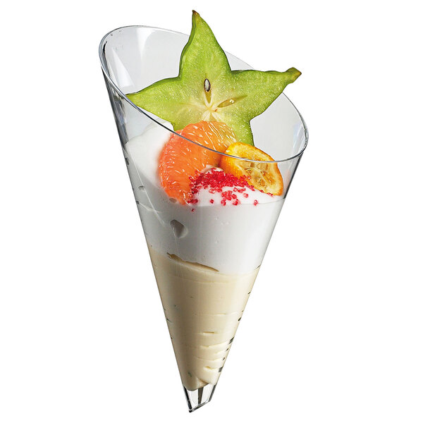 A Solia transparent mini cone with fruit on top.
