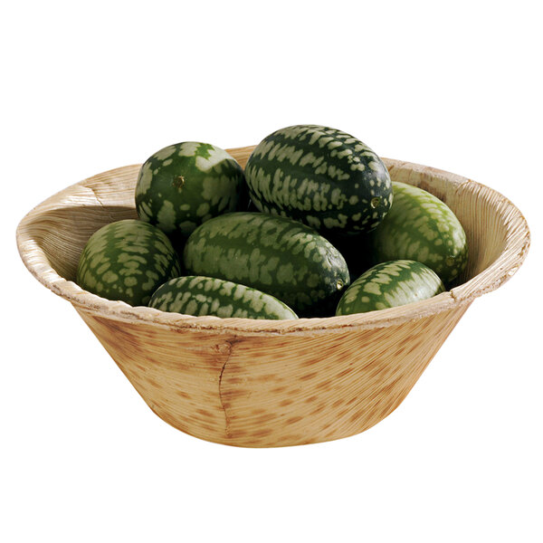 A Solia round bowl filled with green vegetables.