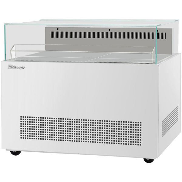 A white rectangular Turbo Air open display merchandiser with a clear glass top.
