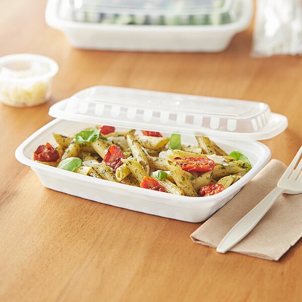 A white Choice rectangular plastic container with pasta and vegetables inside.