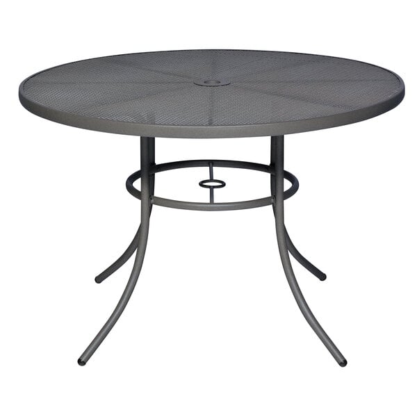A Wabash Valley Sullivan round table with a steel mesh top.