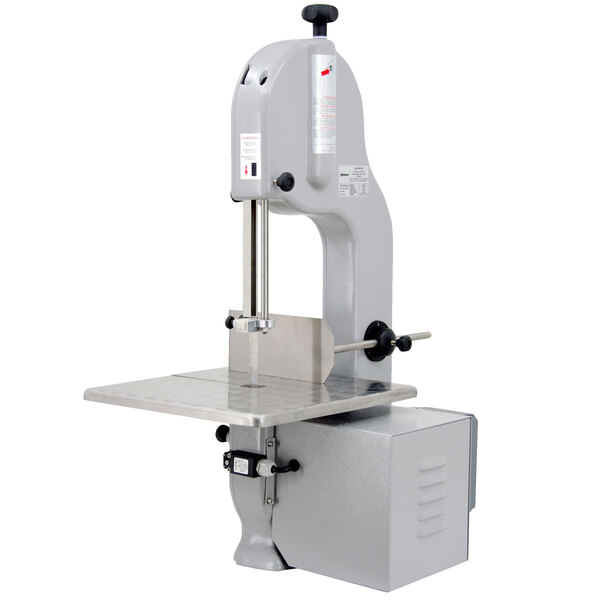 An Omcan tabletop vertical band saw with a metal stand.