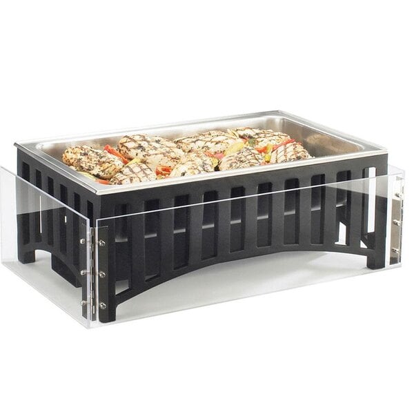 A clear rectangular acrylic chafer wind guard on a black rectangular container of food.