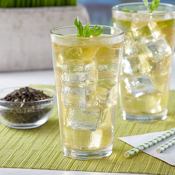 Two glasses of Bossen jasmine green tea with ice and mint leaves.