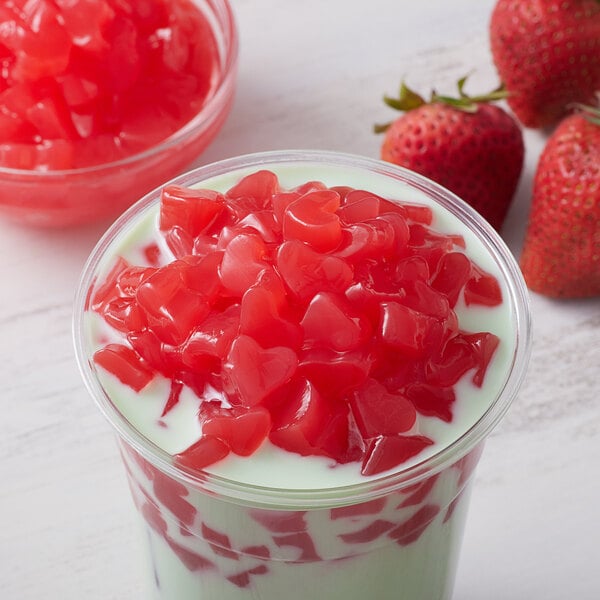 A bowl of Bossen strawberry heart shaped jelly topping with red hearts on top.