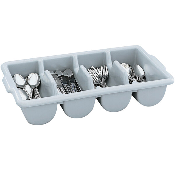 A Vollrath gray polyethylene 4-compartment container with silverware in it.