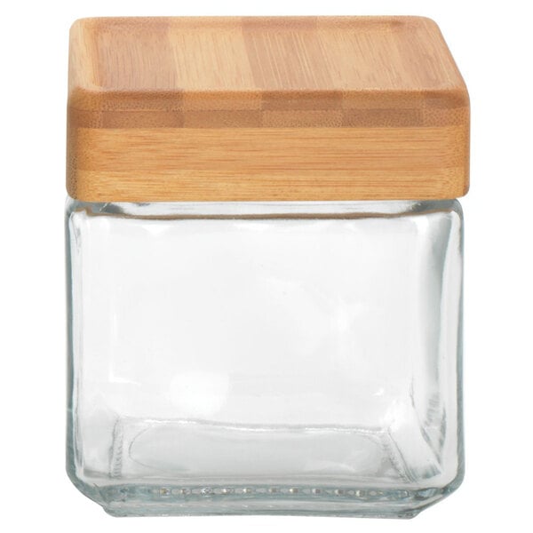 An Anchor Hocking square glass jar with a bamboo lid.