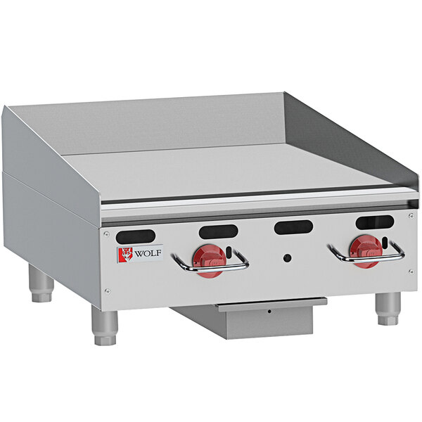 A Wolf stainless steel gas countertop griddle with manual controls and a red knob.