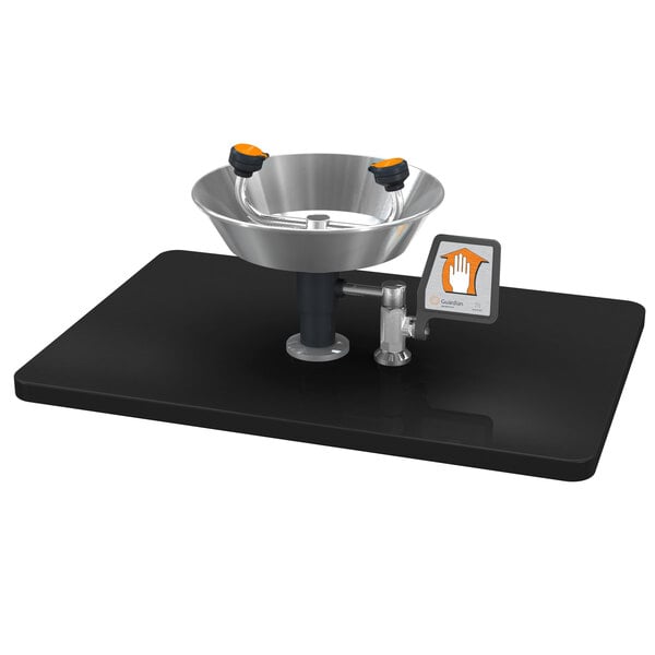 A Guardian Equipment deck mounted eyewash station with a stainless steel bowl.