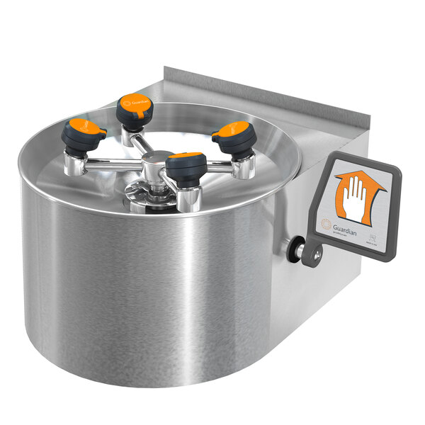 A Guardian Equipment wall mounted eye and face wash station with a stainless steel bowl and skirt, and orange knobs.