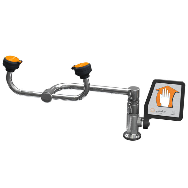 A Guardian Equipment deck mounted eyewash station with metal and orange plastic parts.