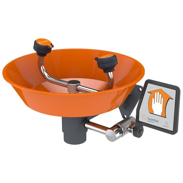 A Guardian Equipment wall mounted eyewash station with an orange bowl and a black handle.
