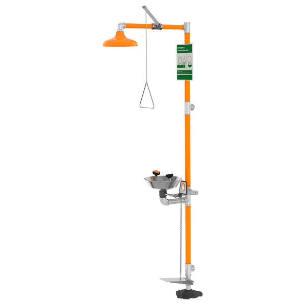 A Guardian Equipment eye and face wash safety station with orange and silver hand and foot controls.