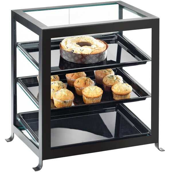 A Cal-Mil black glass display case with muffins on it.