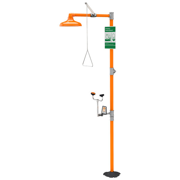 A Guardian Equipment eye and face wash safety station with a green hose and orange stand.