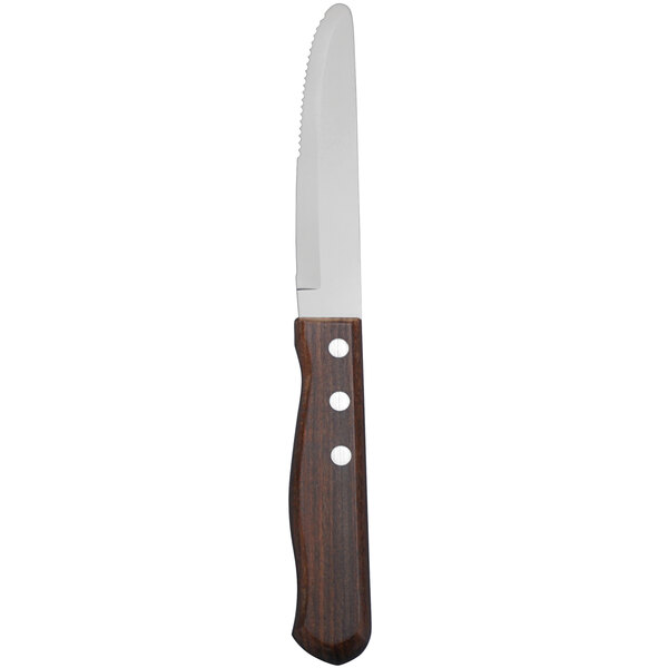 A Delco Pioneer stainless steel steak knife with a wood handle.