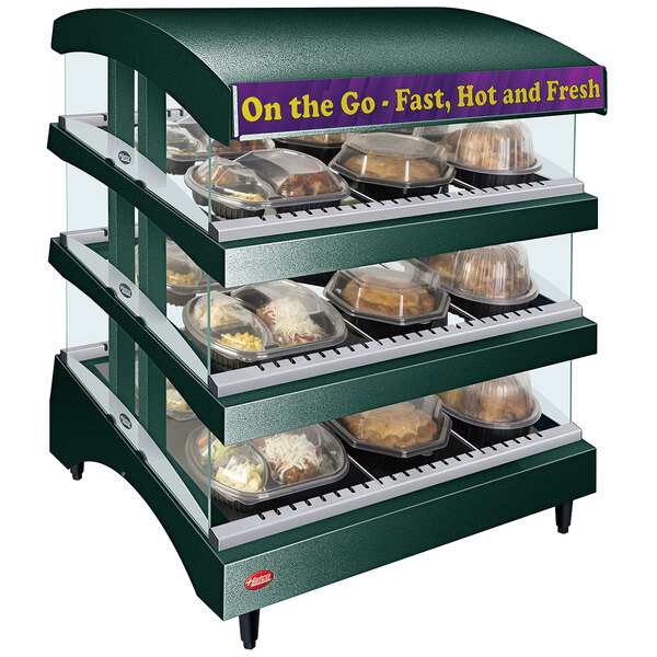 A Hatco countertop food warmer with food on display shelves.