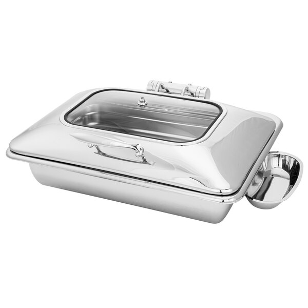 A Walco stainless steel rectangular chafer with a glass lid on a counter.