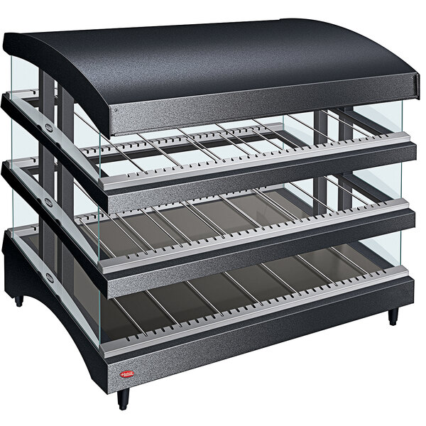 A black and silver Hatco countertop food warmer with three heated glass shelves.