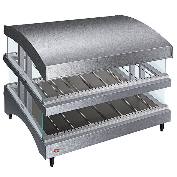 A gray Hatco countertop hot food warmer with slanted double shelves and a curved glass top.