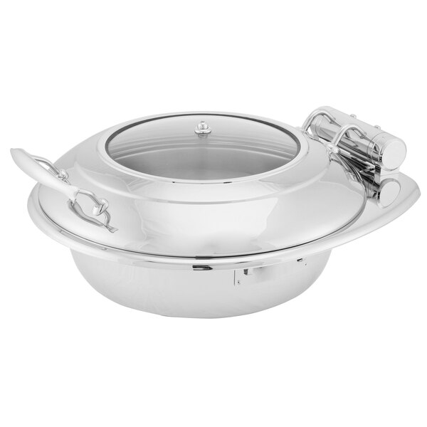 A Walco stainless steel round chafer with glass top lid and spoon holder.