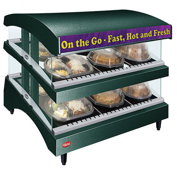 A Hatco Green Glo-Ray heated glass display case with food trays in it.
