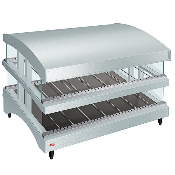 A white Hatco countertop food warmer with a slanted glass top over two heated shelves.