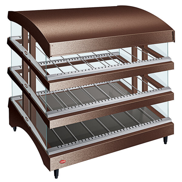 A Hatco Copper Glo-Ray heated glass merchandising warmer with three slanted glass shelves.
