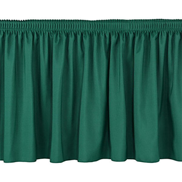 A green shirred stage skirt with pleated edges.