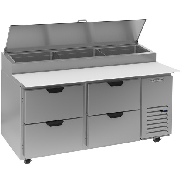 A Beverage-Air stainless steel counter with 4 clear lid drawers.