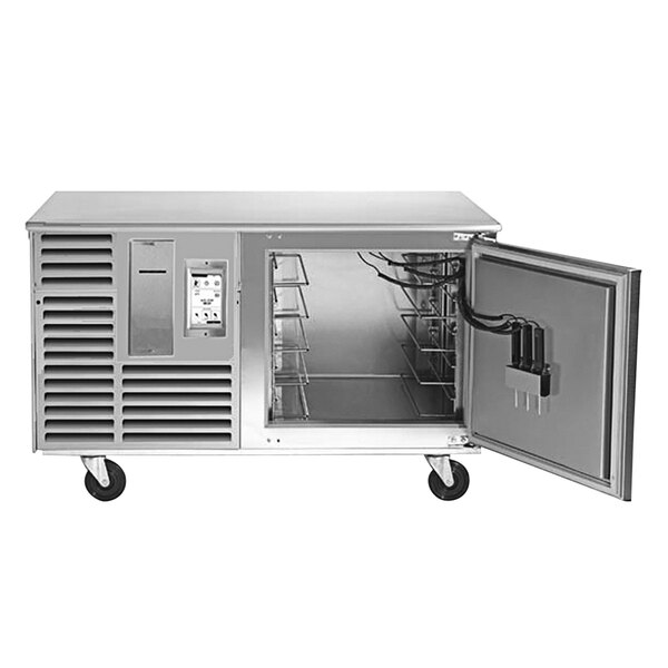 A Traulsen stainless steel right-hinged undercounter blast chiller with the door open.