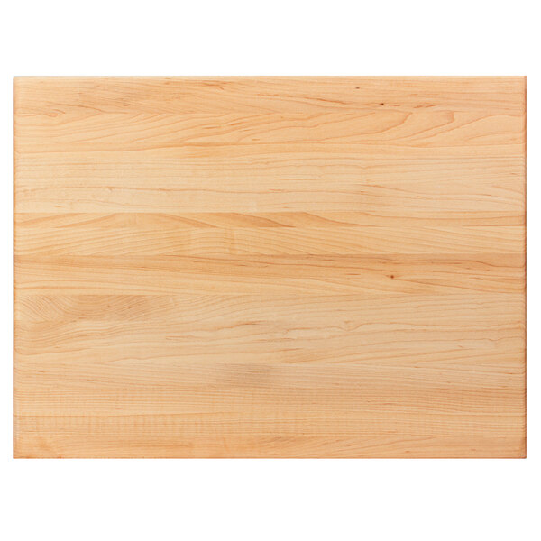 A John Boos maple wood cutting board with hand grips.