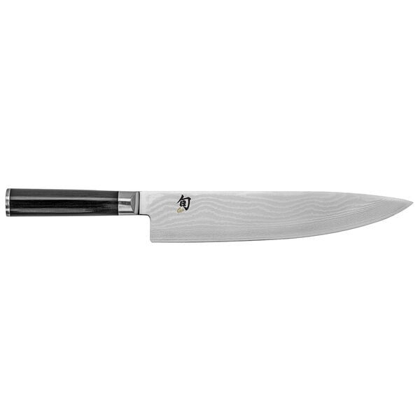 A Shun Classic chef knife with a black and silver handle.