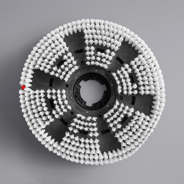 A black circular brush with white bristles.